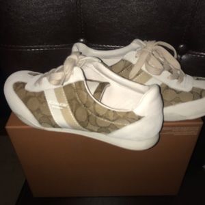 Khaki & White Coach gym shoes.